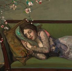 a painting of a woman sleeping on a green couch next to a flowered branch