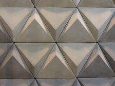 the wall is made up of triangular shapes