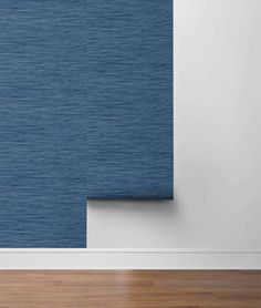 a blue roller blind in an empty room