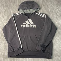 Vintage 2000s Adidas Three Stripes Logo Stitched Embroidered Sportswear Athletic Black Graphic Hoodie Double Extra Large Mens Condition:  Fair Used Condition  = V Cut On The Neckline Plus Distressing Throughout The Hoodie To Age And Wear  Measurements: Please see photos above for all measurements IF YOU BUY TWO OR MORE ITEMS USE THE CODE BUNDLE @ CHECK TO SAVE 20% WE SHIP WITHIN 24 HOURS AFTER PURCHASE! Please be aware that we do not offer free returns!! The Buyer is responsible for the cost of the return label. Follow us on TikTok & Instagram @findsnostalgic and tag us in your finds Black Graphic Hoodie, 2000s Adidas, Adidas Three Stripes, Vintage 2000s, Saint Paul, V Cut, V Cuts, Graphic Hoodie, Graphic Hoodies