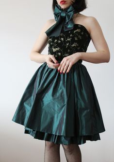 Vintage Max Mara Pianoforte green forest dress. Velvet bustier embroidered with gold floral design. Fluffy silk skirt with tulle underskirt. Silk band to tie at the waist or wherever you want. Long hidden side zip. Made in Italy. Excellent vintage conditions. Tag size 8 uk. Bust 85 cm; 33,5'' Waist 33 cm; 13'' (x2) Lenght 80 cm; 31,5'' Model's size 8 uk h 163 cm. Green Dresses With Boned Fitted Bodice, Green Dress With Fitted Bodice, Green Dresses With Boned Bodice, Green Velvet Dress For Wedding, Green Dresses With Boned Bodice For Prom Season, Green Dresses With Boned Bodice For Prom, Green Forest Dress, Festive Fitted Dress With Full Skirt, Elegant Green Corset Dress With Boned Bodice