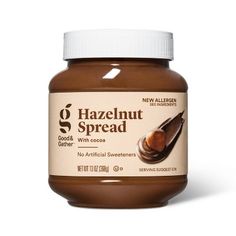 the jar of hazelnut spread sits on a white surface