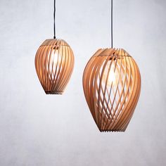 two wooden lamps hanging from the ceiling