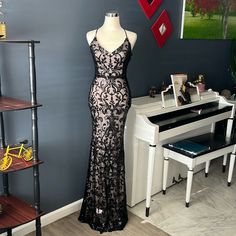 Beautiful Long Party Dress Lined With Sequin V-Neck And Cross Back And Back Zipper In The Back With Label New Lace V-neck Maxi Dress For Party, Black Lace Backless Maxi Dress, Party Lace V-neck Maxi Dress, Black Lace V-neck Evening Dress, Lace V-neck Evening Dress For Party, Black Lace Maxi Dress For Party, Black V-neck Evening Dress For Party Season, Black V-neck Evening Dress For Night Out, Black V-neck Evening Dress For Spring