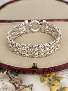 Super chunky vintage sterling silver multi-strand Byzantine chain link bracelet. Heavy and fabulously wide piece with oversized c-clasp. Measures approximately 18.9cm in length by 1.6cm in width. Stamped ITALY 925 on clasp. All items are photographed in as much detail as possible to convey quality and condition. This piece is in lovely, vintage condition with minor signs of wear and cleanable tarnish to silver expected of age.  Please see all photos for reference. Please message upon purchase if Silver Chunky Classic Jewelry, Classic Chunky Silver Jewelry, Classic Silver Chunky Jewelry, Chunky Silver Bracelet Jewelry, Vintage Silver Multi-strand Jewelry, Byzantine Chain, Super Chunky, Multi Strand, Chain Link Bracelet