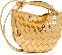 Intrecciato-woven laminated patent lambskin shoulder bag in metallic gold tone. · Sculptural metal carry handle · Knotted accents at fixed crossbody strap · Magnetic closure · Unlined · H5.5 x W8 Supplier color: Gold m brass Designer Gold Shoulder Bag With Round Handle, Designer Gold Bags With Round Handle, Gold Luxury Bag With Woven Leather, Luxury Gold Shoulder Bag With Braided Handles, Gold Shoulder Bag With Braided Handles For Formal Occasions, Formal Gold Shoulder Bag With Braided Handles, Elegant Gold Shoulder Bag With Woven Leather, Chic Gold Bags With Intrecciato Weave, Luxury Gold Bag With Glossy Finish