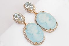 BIG CAMEO EARRINGS, Blue Turquoise Cameo Earrings, Victorian Vintage Bridal Earrings, Chandelier Ice Blue Earrings, Earrings, Gift Details of item: Metal: 24K Gold Plated ( rose or yellow ) or silver plated - Nickel Free Gemstone: crystal and acrylic cameo Earrings Size: 2*0.9 inches The earrings will be packed in a gift box. Ready to ship 1-3 days, FOR MY EARRINGS COLLECTION HERE: https://www.etsy.com/il-en/shop/rebekajewelry?section_id=14222612&ref=shopsection_leftnav_3 TO GET TO MY ETSY S Vintage Bridal Earrings, Dark Blue Earrings, Climbing Earrings, Long Bridal Earrings, Bridal Earrings Chandelier, Ear Crawler Earrings, Earrings Chandelier, Cameo Earrings, Victorian Vintage