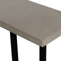 a concrete table with black legs on a white background