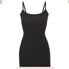 A Buttery Soft Slip Mini Dress That Hugs Your Curves. Form-Fitting And Lightweight, This Style Is Perfect To Wear Under Other Dresses As Second-Skin Lining. Skims Brand New With Tag Size Small Black Seamless Spaghetti Strap Dress, Elegant Black Seamless Mini Dress, Black Spaghetti Strap Seamless Dress, Sleeveless Seamless Black Dress, Seamless Sleeveless Black Dress, Black Stretch Cami Dress, Sleeveless Black Seamless Dress, Black Seamless Mini Dress, Black Spaghetti Strap Dress With Flattering Silhouette