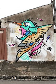 a bird painted on the side of a building