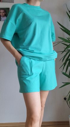 Our cotton two-piece sets are super comfortable to wear. They are light and airy, made from 100% cotton and are great companions in spring and summer that no wardrobe should be without. Of course, you can also wear the T-shirt and the shorts separately and combine them in a variety of ways. The material is super comfortable on the skin and breathable. You can find the set in other colors in our shop. Comfortable Blue Cotton Set, Relaxed Fit Leisure Sets For Spring, Casual Loungewear Sets For Spring, Spring Crew Neck Sets With Solid Color, Summer Crew Neck Set In Solid Color, Solid Color Crew Neck Sets For Summer, Solid Color Crew Neck Summer Set, Solid Color Crew Neck Sets For Spring, Spring Cotton Sets In Short Style