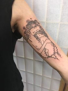 a person with a tattoo on their arm