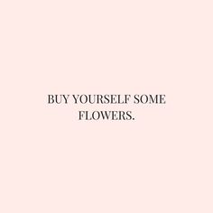 a pink wall with the words buy yourself some flowers