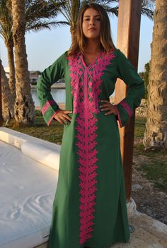 A stunning embroidered Kaftan dress that is elegant, colorful, and unique! The dress is made of Egyptian cotton that has a soft feel to it so you will surely feel comfortable and royal in it. It also comes with a small invisible pocket on the right side of the Kaftan for added practicality. You can wear this Kaftan practically anywhere and for any occasion. You can dress it up with a pair of heels and strut like an Egyptian queen in any gathering, resort, or party. Or you can dress it down with Traditional Green V-neck Tunic, Traditional Green V-neck Dress, Green Kurta With Embroidered Neckline For Eid, Green Tunic Kaftan For Festivals, Multicolor Embroidered Kaftan With Dabka Work, Green Long Sleeve Dress With Embroidered Neckline, Green Kaftan With Resham Embroidery For Festivals, Bohemian Pink Resham Embroidered Kaftan, Green Dress With Embroidered Neckline