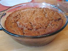 a baked dessert in a glass dish on a wooden table