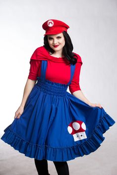 a woman in a red shirt and blue dress with a mushroom on it's chest