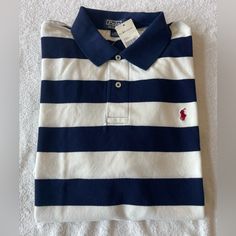 This Classic Polo Ralph Lauren Shirt Is A Must-Have For Any Fashion-Forward Man. The Navy And White Striped Shirt Features A Collared Neckline And Short Sleeves, Making It A Versatile Piece For Any Occasion. Made From 100% Cotton Knit Fabric, The Shirt Is Comfortable And Perfect For All Seasons. The Red Pony Logo Adds A Touch Of Contrast And Sportiness To The Vintage Design. Equestrian Shirt, Colourful Wallpaper, Mens Polo Shirt, Ralph Lauren Mens, Ralph Lauren Long Sleeve, Ralph Lauren Polo Shirts, Vintage Polo Ralph Lauren, Yellow Shorts, Cotton Polo Shirt