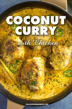 coconut curry with chicken in a skillet on top of a blue countertop and the words coconut curry written above it