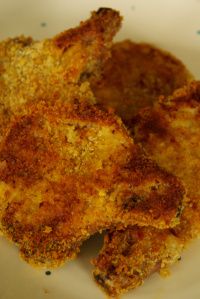 two pieces of fried food on a white plate