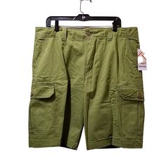 Rio Sportswear Men's Green Brushed Cotton Bermuda Cargo Shorts Size: 38 Waist: 39 Inches Length: 22.5 Inches Front Rise: 12 Inches Inseam: 11 Inches Fabric: 100% Cotton Green Cotton Cargo Pants For Sports, Green Short Activewear With Pockets, Sporty Cotton Cargo Shorts, Green Relaxed Fit Cargo Pants For Sports, Cotton Activewear With Pockets Short Leg, Green Relaxed Fit Cargo Pants For Casual Use, Green Cargo Sports Shorts, Casual Moisture-wicking Cargo Shorts, Green Casual Cargo Pants For Sports