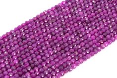 purple glass beads on a white background