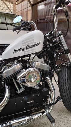 a harley davidson motorcycle parked in front of a building