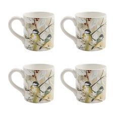 four coffee mugs with birds on them