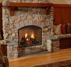 a stone fireplace in a living room