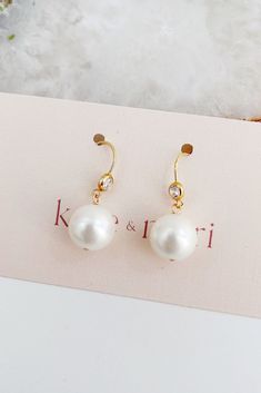 Pearl Wedding Jewelry Ideas For Brides l Rehearsal Wedding Accessories l Classic pearl earrings for a bride looking for timeless wedding day jewelry. Classic and modern wedding jewelry for brides, bridesmaids, and mother of brides. Wear these pearl wedding earrings for your rehearsal dinner, bridal shower, and your wedding for a touch of timeless elegance. Shop all your bridal jewelry needs at shopkateandmari.com. Elegant 14k Gold-filled Earrings With Pearl Charm, Elegant 14k Gold Filled Earrings With Pearl Charm, Elegant Pearl Charm Earrings In 14k Gold Filled, Formal 14k Gold Filled Earrings With Pearl Charm, Elegant Formal 14k Gold Filled Pearl Earrings, Elegant 14k Gold-filled Pearl Earrings For Formal Occasions, Formal White Pearl Earrings 14k Gold Filled, Formal 14k Gold Filled Pearl Earrings With Ear Wire, 14k Gold Filled Pearl Earrings For Formal Occasions