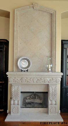 a white fireplace with a mirror above it