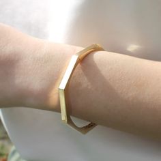 Elevate your accessory game with our solid gold geometric bracelet, available exclusively on Etsy. This unique and timeless cuff bangle is a perfect luxury gift for loved ones, and is sure to add sophistication to any outfit. Shop now and make a statement with this stunning piece of jewelry. Size: 60 mm Width (inside measurements) Material: 14K Gold Karat: 14 Karats Gold (585) BEST CHOICE FOR GIFT🎁 You can buy the best gifts for your loved ones from this shop with our special packaging that we use for each product. DELIVERY🚀 Your order will be crafted and ready to ship within 1 - 5 business days.We use express shipping for all orders.Please contact us if you have any urgency. Estimated delivery time: USA 1-3 days EU   1-3 days AUSTRALİA  2-7 days CANADA  2-4 days Other 2-8 days Modern 14k Gold Bangle Bracelets, Elegant Adjustable Geometric Bracelet, Elegant Geometric Bracelets Gift, Elegant Geometric Bracelets For Gift, Elegant Geometric Bracelets For Gifts, Gold Geometric Bracelet For Gift, Modern 14k Gold Bracelets As A Gift, Modern 14k Gold Bracelets As Gifts, Modern 14k Gold Bracelets For Gifts