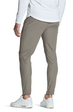 Stretchy, sweat-wicking Versaknit™ fabric keeps you day-to-night comfortable in flat-front pants that take you from desk to drinks to dinner with ease. 28" inseam (size Medium) Zip fly with snap closure Side-seam pockets Moisture-wicking fabric engineered for dryness and comfort 100% polyester Machine wash, tumble dry Imported Modern Stretch Bottoms For Loungewear, Sporty Bottoms With 5-inch Inseam For Everyday, Relaxed Fit Solid Bottoms In Recycled Polyester, Relaxed Fit Bottoms In Recycled Polyester, Versatile Bottoms With Comfort Stretch And Elastic Side Panels, Travel Bottoms With Elastic Waistband And Nylon Material, Go-dry Elastane Bottoms With 5-inch Inseam, Functional Elastane Bottoms With Comfort Waistband, Sporty 4-way Stretch Pants For Everyday