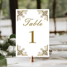 a table number sign sitting on top of a white table