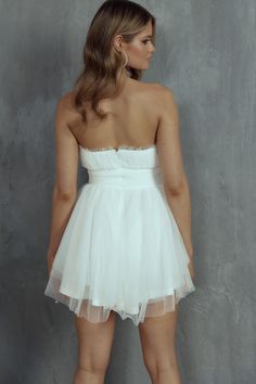 White mini dress Lined Strapless style Tulle mesh overlay Frill neckline detail Zipper in back You'll feel like a fairytale princess in our pretty Fayette mini dress. We are obsessed with its floaty mesh overlay and frill detail in the neckline. Perfect for bridal events or a birthday celebration. Team it with diamante mules and a satin clutch for a dreamy, romantic look that's fit for royalty. MODEL INFO Model is wearing size XS Height: 5'8" Bust: 33" Waist: 25.5" Hips: 35.5" GARMENT INFO Flat Bridal Events, Fairytale Princess, Yellow Bridesmaid Dresses, Satin Clutch, Yellow Bridesmaids, Mesh Mini Dress, Mini Dress White, Bridal Event, Lace Bodycon Dress