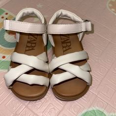 Cute Sandals. Never Worn(My Babies Foot Didn’t Fit) And Return Date Was Missed White Adjustable Non-slip Sandals, White Non-slip Sandals For Vacation, White Non-slip Sandals For Beach, White Non-slip Beach Sandals, Non-slip White Beach Sandals, White Sandals With Soft Sole For Spring, White Synthetic Sandals With Soft Sole, White Non-slip Open Toe Sandals, White Non-slip Closed Toe Sandals