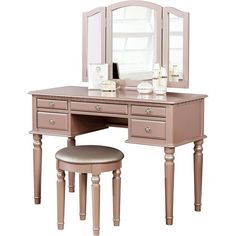 Get ready to start your day with this versatile vanity set. Crafted from solid rubberwood, manufactured wood, and birch veneers, this set includes one vanity table, one three-panel mirror, and one upholstered stool. Five drawers provide a place for brushes, makeup, and more. Turned legs bring out this sets traditional side, while a neutral finish allows it to blend with a variety of color palettes and aesthetics. Assembly is required. Available in Pink Rose Gold Color, Black, White, Silver and C Rose Gold Vanity, Bedroom Vanity Set, Foldable Mirror, Gold Vanity, Bedroom Makeup Vanity, Mirror Stool, Trifold Mirror, Gold Furniture, Glam Bedroom