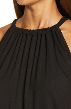 A stretchy knit and a shoulder-showing design put this halter-neck tank at the top of both the comfy and cute wardrobe rankings. 23" length Ties at neck Halter neck Sleeveless, with cutaway shoulders 95% rayon, 5% spandex Machine wash, dry flat Imported Women's Clothing Versatile Black Halter Neck Tank Top, Sleeveless Tops With Elastic Neckline For Summer, Spring Sleeveless Tops With Elastic Neckline, Fitted Sleeveless Top With Elastic Neckline, Fitted Sleeveless Halter Top With Elastic Neckline, Versatile Sleeveless Halter Top, Sleeveless Stretch Top With Elastic Neckline, Versatile Solid Color Sleeveless Halter Top, Stretch Sleeveless Top With Elastic Neckline