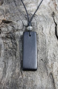 "With a beautiful glossy finish, this unique Irish Bog Oak pendant is adorned with a quality cast and lead free pewter Celtic knot bead. Bog-wood comes from ancient forests that once covered Ireland. Huge oaks and yew trees have been buried in peat bogs and preserved from decay by the acidic and anaerobic bog conditions, sometimes for hundreds or even thousands of years. The wood is usually stained by tannin dissolved in the acidic water (black for the oak and a lovely brown for the yew). Bog-wo Rectangular Black Beaded Jewelry Gift, Rectangular Black Beads Jewelry Gift, Rectangular Black Beads Jewelry As Gift, Celtic Images, Wooden Jewelery, Peat Bog, Wood Anniversary Gift, Wood Anniversary, Wooden Jewellery