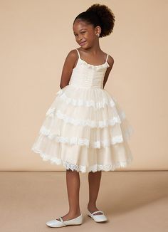 Cloie is our adorable flower girl dress cut from tulle. She features a scoop neckline embellished with ruffles and spaghetti straps. The look is complete with a tiered A-line skirt. Kids Reference, Classic Flower Girl Dress, Flower Girl Dresses Lace, Petal Flower Girl Dress, Whimsy Flowers, Flower Girl Dresses Champagne, Bridal Party Outfit, White Champagne, Eclectic Wedding