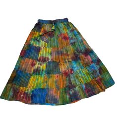 Presenting PuzzleStack’s exquisitely crafted Tie Dye Patchwork Skirt - a true manifestation of Boho Hippie style, carefully handmade to perfection! Crafted from up-cycled, premium cotton fabric, this skirt not only adds a touch of sustainability but also ensures unparalleled comfort with its loose-fitting design.Designed for your utmost convenience, the skirt features an elastic waist with a convenient drawstring, allowing you to customize the fit to your preference effortlessly. What sets this Multicolor Tiered Hippie Skirt, Fitted Multicolor Cotton Maxi Skirt, Hippie Style Cotton Maxi Skirt, Relaxed Fit Cotton Hippie Skirt, Cotton Maxi Skirt In Hippie Style, Relaxed Cotton Skirt In Hippie Style, Hippie Style Long Cotton Maxi Skirt, Multicolor Relaxed Cotton Skirt, Cotton Multicolor Gathered Maxi Skirt