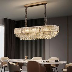 a chandelier hanging over a dining room table