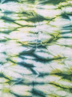 a tie dyed shirt with green and yellow colors