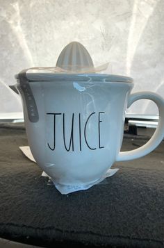 a tea cup with the word juice written on it