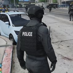 a police officer is standing on the sidewalk