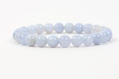 "Blue Chalcedony Throat Chakra balancing bracelet. The bracelet is made of 8mm round natural Blue Chalcedony beads. The listing is only for the 8mm Blue Chalcedony bracelet. Please select the bracelet size at checkout To determine the correct size of the bracelet measure the wrist, at the smallest part of the wrist, between the hand and the wrist bone. To measure your wrist you can use a flexible measuring tape. If you do not have one use a string, or a strip of paper and a ruler. Wrap the strin Chalcedony Bracelet, Healing Gemstone Bracelets, Handmade Gemstone Jewelry, Bracelets With Meaning, Chalcedony Stone, Gold Vermeil Jewelry, Brown Jewelry, Gemstones Jewelry, Improve Memory