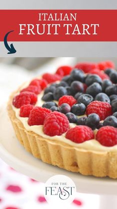 a pie with berries and blueberries on top is shown in the foreground text reads italian frut tart