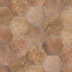 a brown and tan tile floor with hexagonal tiles