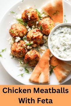 chicken meatballs with feta sauce on a white plate