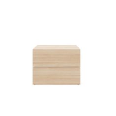 a wooden box sitting on top of a white wall