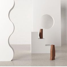 an abstract sculpture is shown in the middle of a room with white walls and flooring